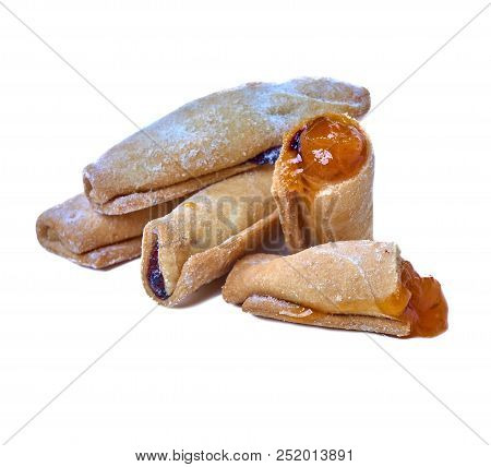 Cookies Rolled With Cherries And Black Currants Isolated On A Wh