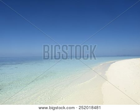 White Sand, Blue See And Clear Sky