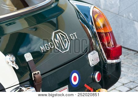Saalbach-hinterglemm, Austria - June 21 2018: Vintage Car Mg Mgc Gt Coupe Oldsmobile Veteran Stands