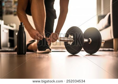 Morning Workout Routine In Home Gym. Fitness Motivation And Muscle Training Concept. Man In Sneakers
