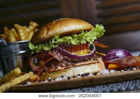 Delicious Burgers With Beef, Tomato, Cheese And Lettuce