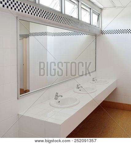 Bathroom At Office.handbasin And Mirror In Toilet