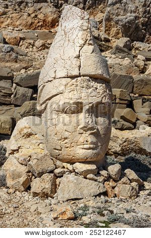 Antiochos Statue At East Terrace On Top Of Nemrut Mountain. Stone Heads At The Top Of 2150 Meters Hi