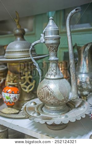 The Old Arabic Dallah Coffee Pot With Fine Islamic Pattern In Antique Store Of Antalya, Turkey.