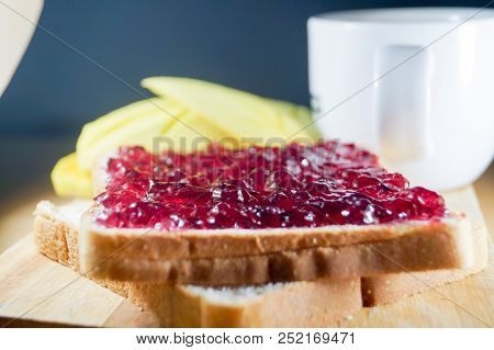 Morning Breakfast Have Blueberry Jam On Brown Bread With Mango And Coffee. It Is Healthy Food And Go