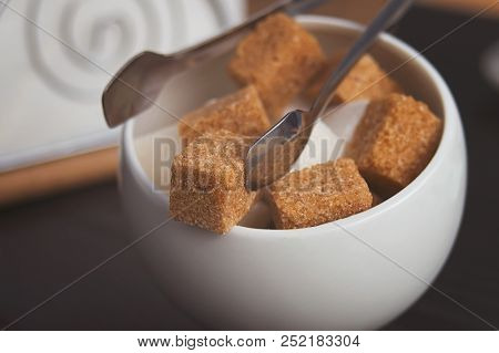 Sugar Bowl With Cubes Of White Cane Sugar, Sugar-tongs And Napkins. Atmosphere And Table Appointment