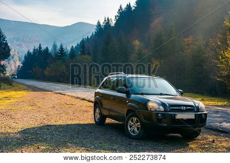 Mizhhirya, Ukraine - Oct 21, 2017:  Hyundai Tucso 2010 Suv On The Road Side In Forested Mountain. Lo