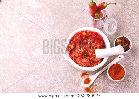 Traditional Maghrebi Hot Chili Pepper Sauce Paste Harissa. Adjika
