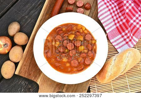 Potato Goulash With Debreziner Sausage Or German Name Is Kartoffelgulasch Mit Debreziner On Wooden B