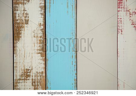 Wall Made Of Multi-colored Wooden Boards. Abstract Grunge Wood Texture Background