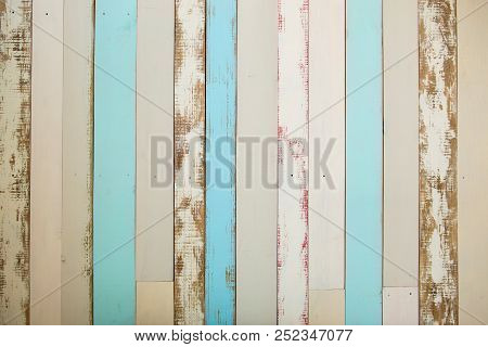 Wall Made Of Multi-colored Wooden Boards. Abstract Grunge Wood Texture Background