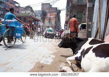KATHMANDU, NEPAL - JULY 17, 2018: Street in the Thamel district, Kathmandu. Thamel is a tourist district with many hotels, souvenir shops, restaurants and nightlife