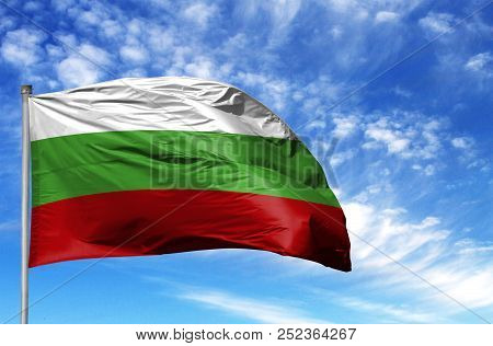 National Flag Of Bulgaria On A Flagpole In Front Of Blue Sky