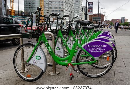 Liverpool, Uk: Aug 3, 2018: Bicycles Wait To Be Hired On The Strand, Liverpool. The City Bike Scheme