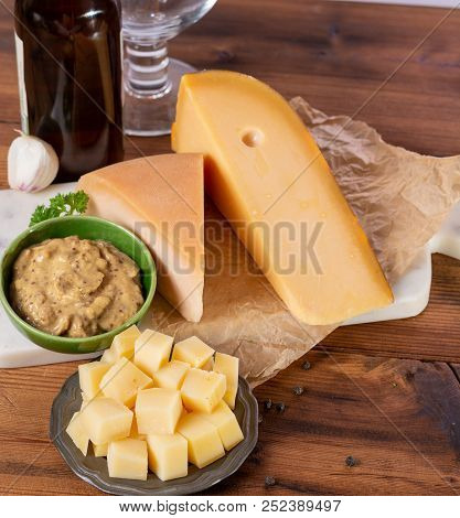 Dutch Finger Food Usually Served With Glass Of Beer, Cubes Hard Old Cows And Goat Cheese With Dijon