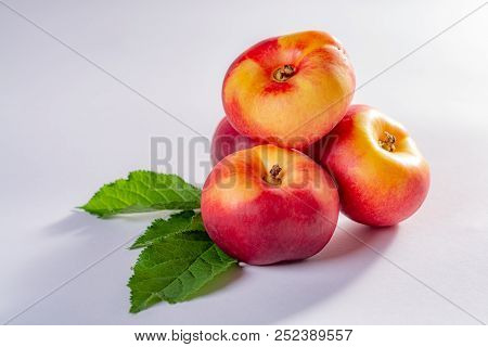 New Hybrid Sweet Fruit Nectarina Platerina, Flat Saturn Or Donut Nectarine Peaches Close Up