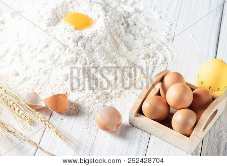 Baking Egg On Powder , Eggs In Bow , White Wood
