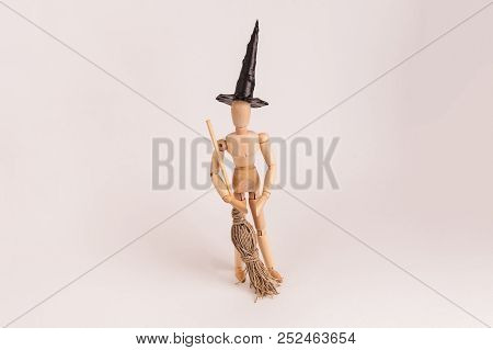 Halloween Wooden Jointed Dummy Doll Witch Wearing Pointed Black Hat And Holdinga Broom On Solid Back