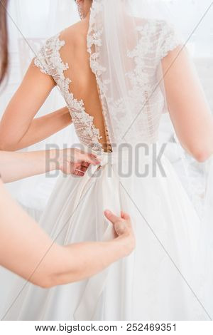 Grate Choice Of Gorgeous Fashion Dresses Hanging On Racks In Woman's Wardrobe. A Big Variety Of Spar