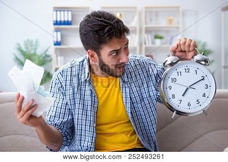 Man frustrated at bills he needs to pay in time management conce