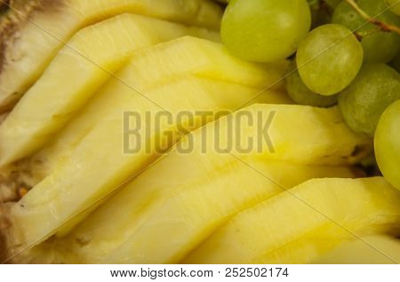 Very Nice And Artistically Sliced Fruits On A Platter.