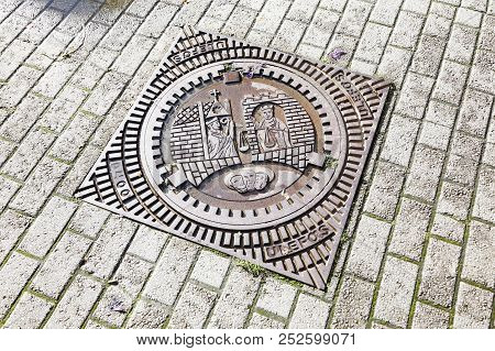 Trondheim, Norway - September 30, 2016: A Trondheim Manhole Made Of Cast Iron With Attached Cover Di