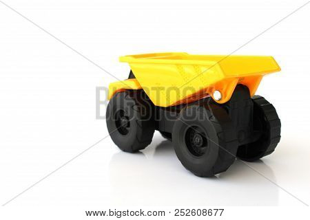 Isolated Toy Truck With White Background In Yellow And Black Colors