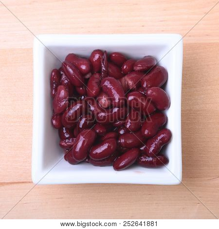 Heap Of Canned Red Kidney Beans In The Sauce In White Bowl. Vegetarian Food. Phaseolus Vulgaris.