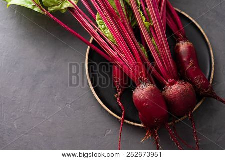 Beet, Beetroot Bunch On Wooden Plate On Grey Stone Background. Copy Space. .