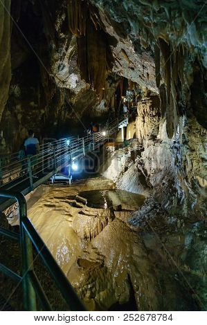 Fluminimaggiore, Sardinia, Italy - August 07, 2018: Tourists Visit The Cave Of 