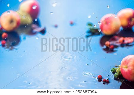 Autumn Rain Frame With Copy Space. Unfocused Apples With Water Drops And Place For Text. Fresh And A