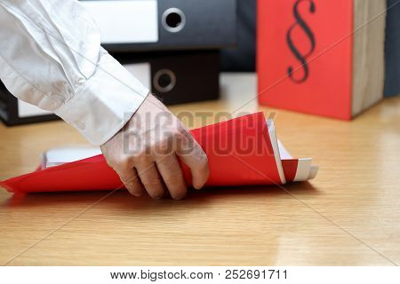 Man Takes A File- Folder On An Office Workplace