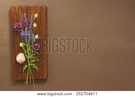A Beautiful Summer Bouquet, Wildflowers, Wild Onions, Veronica Long-leaved Violet On A Wooden Backgr