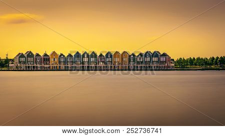 The Famous Rainbow Houses At Sunset In The City Of Houten In Netherlands. Long Exposure.