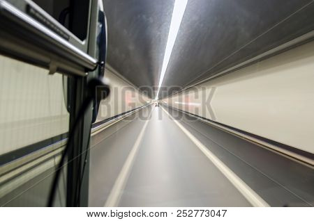 Mountain Tunnel, Shot From The Bus Window. Long Exposure.