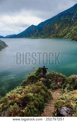 Happy Person At A Beautiful Lake / Lagoon Of Fire (lagoa Do Fogo) On Green Volcanic Island Of Sao Mi
