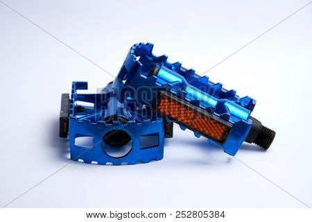 Blue Bicycle Pedals With Reflector Isolated On White Background.