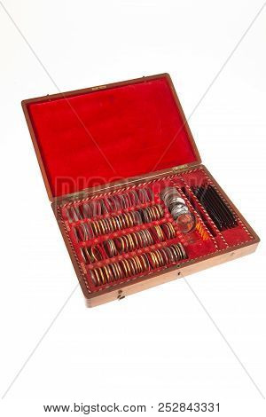 Old Optometric Set Of Lenses On Isolated Studio Background