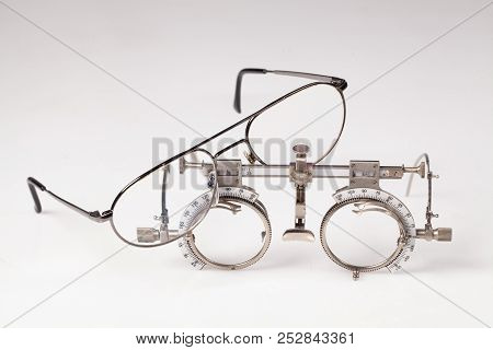 Old Optometric Device To Choose The Correct Lense On Isolated Background