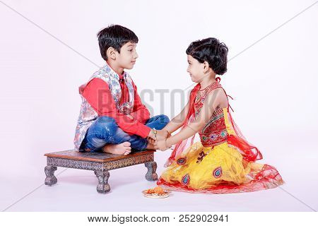 Cute Indian Child Brother And Sister Celebrating Raksha Bandhan Festival