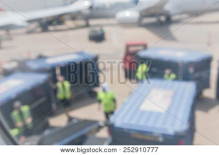 Abstract Blurred Airport Crews Offloading Passengers Luggage On Arrival