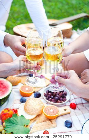 Summer Picnic Basket On The Green Grass. Food And Drink Concept. Friends Party Time