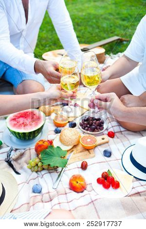 Summer Picnic Basket On The Green Grass. Food And Drink Concept. Friends Party Time