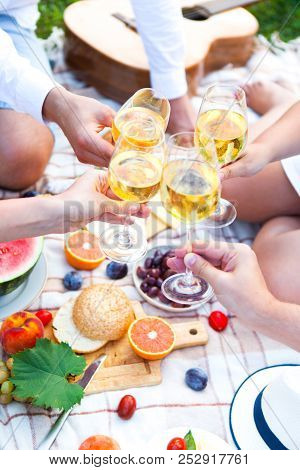 Summer Picnic Basket On The Green Grass. Food And Drink Concept. Friends Party Time