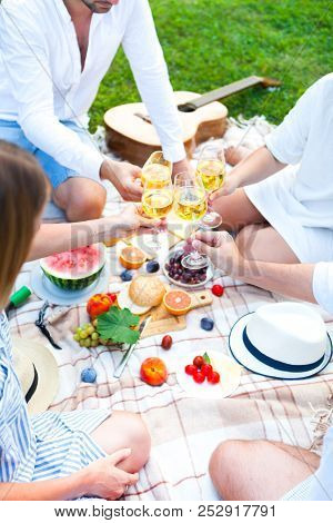 Summer Picnic Basket On The Green Grass. Food And Drink Concept. Friends Party Time
