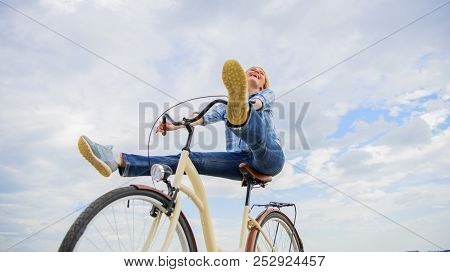 Woman Feels Free While Enjoy Cycling. Girl Rides Bicycle Sky Background. Cycling Gives You Feeling O