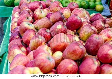 A Bunch Of Whole Ripe Apple In Fruit Market