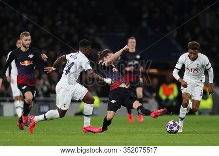LONDON, ENGLAND. 19 FEBRUARY 2020. Defender Serge Aurier of Tottenham, Midfielder Marcel Sabitzer Of Leipzig and Midfielder Gedson Fernandes of Tottenham compete for the ball during the UEFA Champions