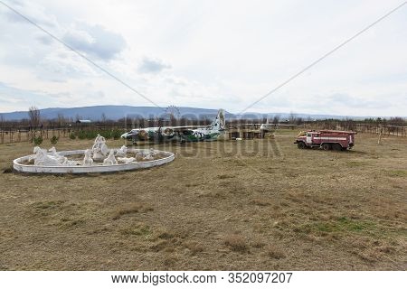 Belogorsk, Crimea, Russia-march 10, 2019: Sculptures, An Old Plane, A Fire Truck For Decoration On T