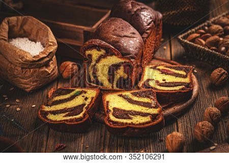 Whole And Sliced Sweet Braided Bread With Walnuts And Turkish Delights